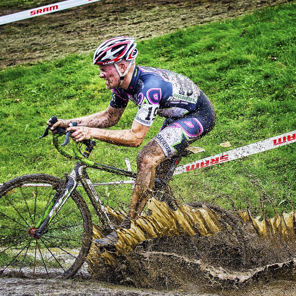 Pedal Power Team rider racing cyclocross through mud